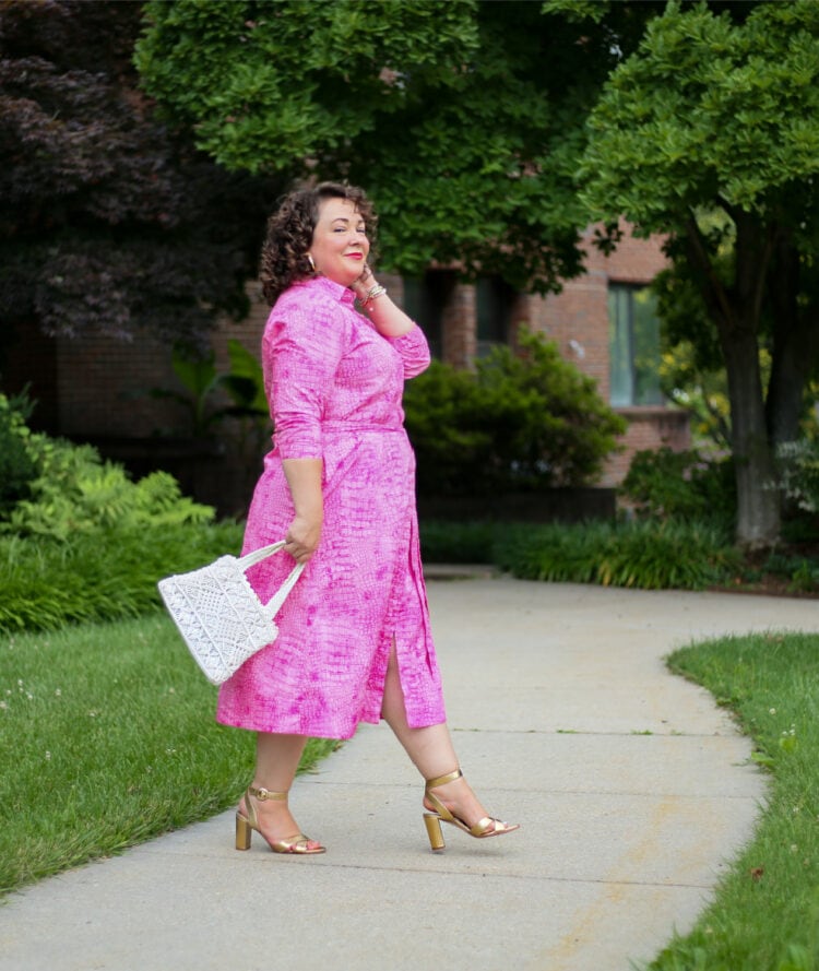Alison of Wardrobe Oxygen in a pink poplin belted shirtdress from Chico's