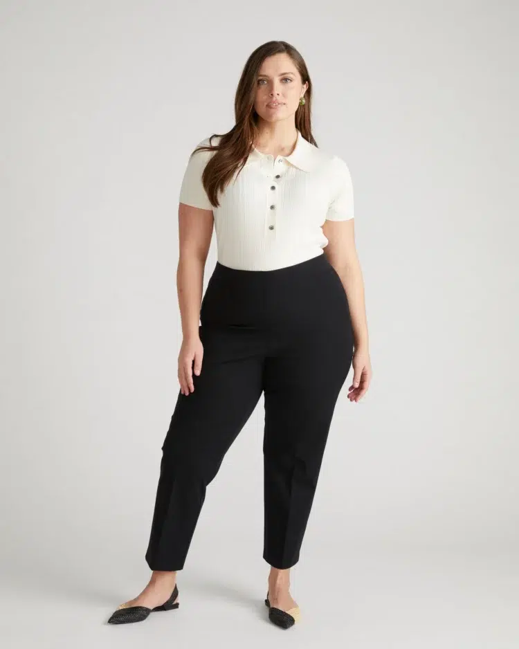 A model wearing a pair of black Magic Cotton Straight Leg Pants from UNiversal Standard