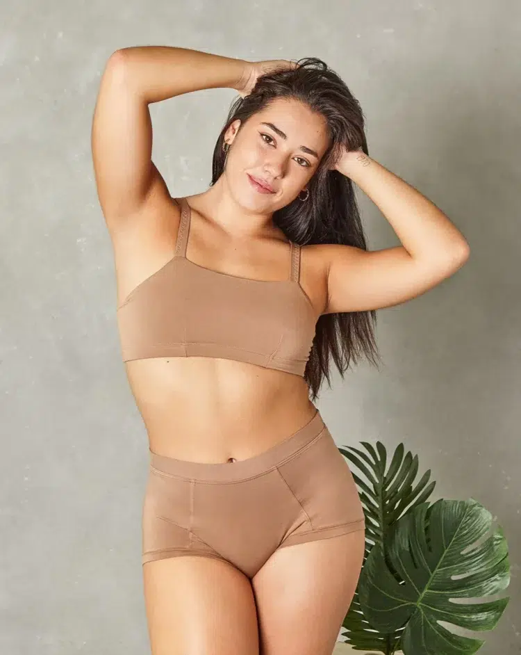 Model wearing a beige bralette and matching Huha Mineral Undies Brief