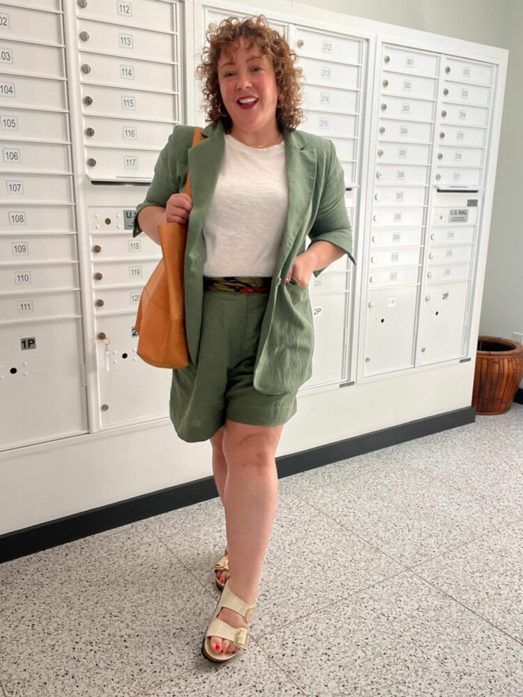 Alison in the ABLE green linen blazer and shorts with a slub knit tee and tan leather tote