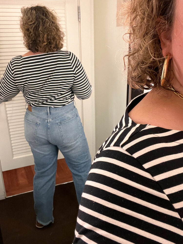 Alison of Wardrobe Oxygen in a black and white striped Breton tee from Universal Standard and ABLE Chessie straight jeans