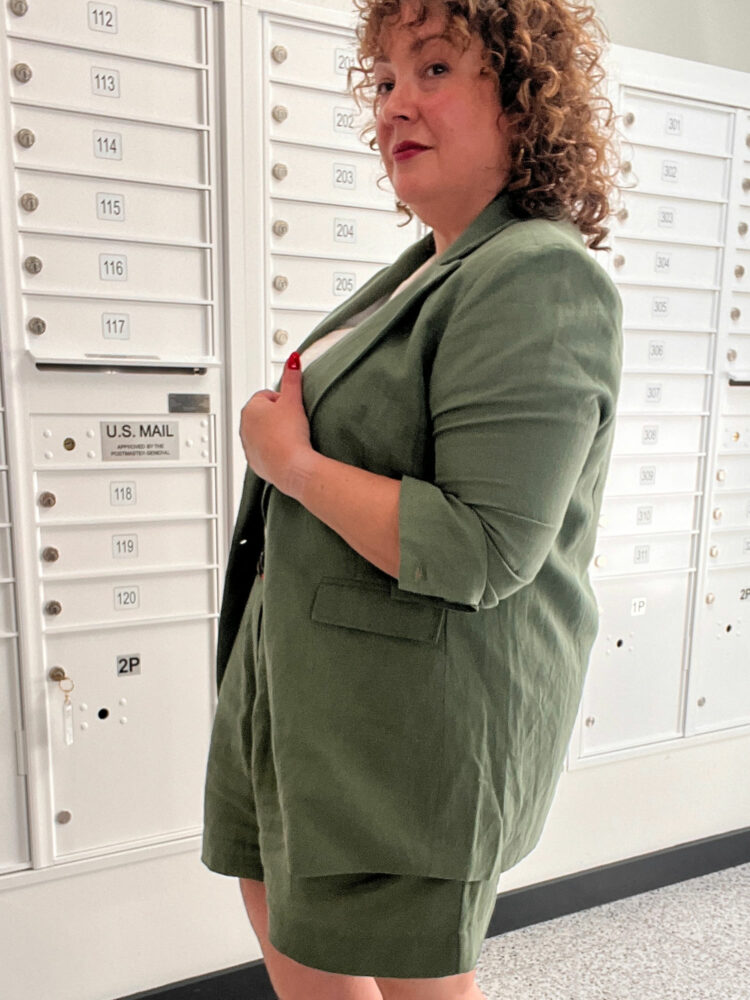 Alison of Wardrobe Oxygen in a green linen blazer and matching dress shorts from the sustainable fashion vbrand ABLE