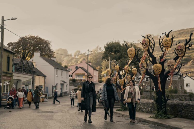 The character Dove walking through Bodkin during a festival in the Netflix series