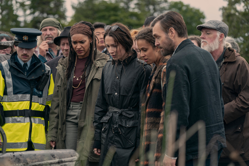 The three podcasters in the Netflix series Bodkin, at a crime scene with a member of the Garda