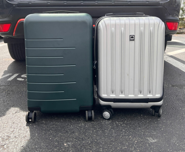 The Quince 20" carry-on next to the Delsey Helium International carry-on spinner