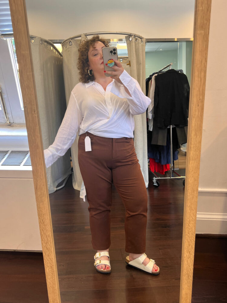 Alison Gary of Wardrobe Oxygen in the white Toni top tucked into Universal Standard x Henning brown ankle pants