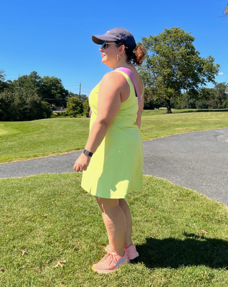 side view of a short over 40 woman wearing the old navy powersoft athletic skort dress