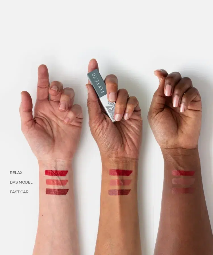 Flyte.70 L+L.LipLacquer swatched on the wrists of three women of different skintones