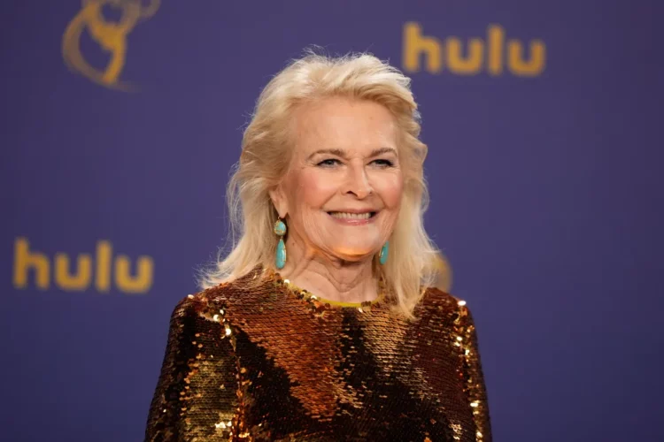 Candice Bergen at the 2024 Emmy Awards wearing a copper sequined long sleeve gown from Dolce and Gabbana with turquoise drop earrings