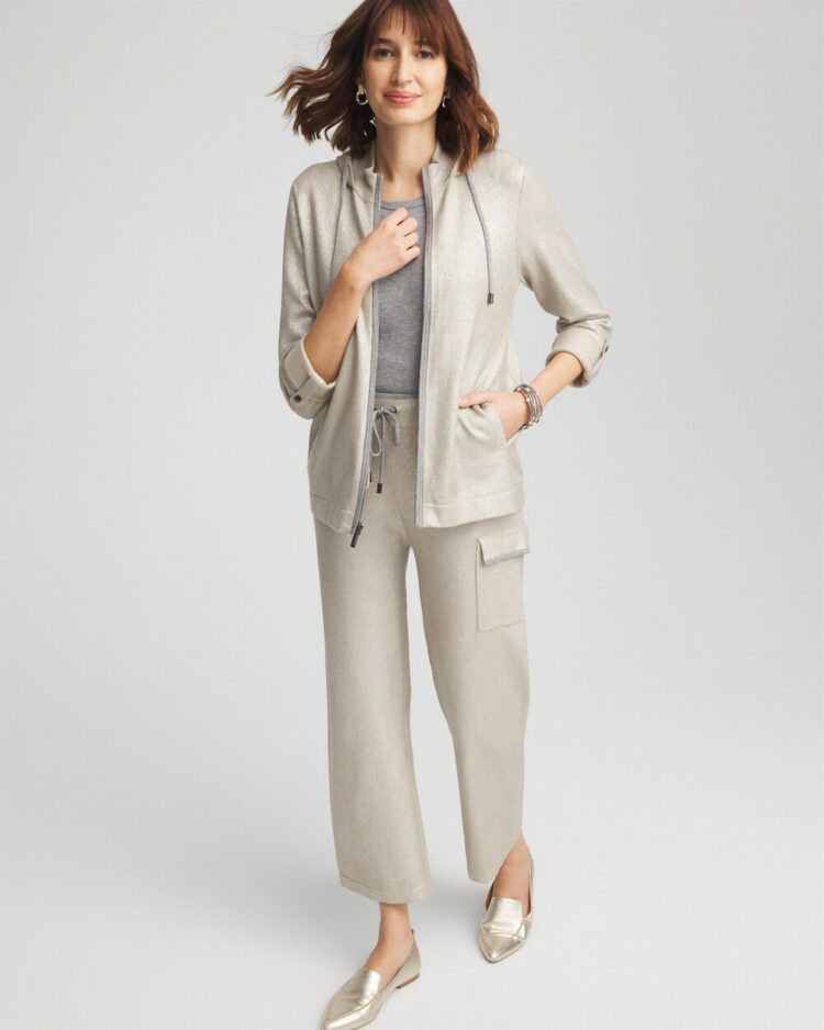 Woman in a champagne colored foiled cashmere jacket and pants with a gray cashmere sweater underneath from the Chico's Zenergy collection of athleisure for Winter 2024