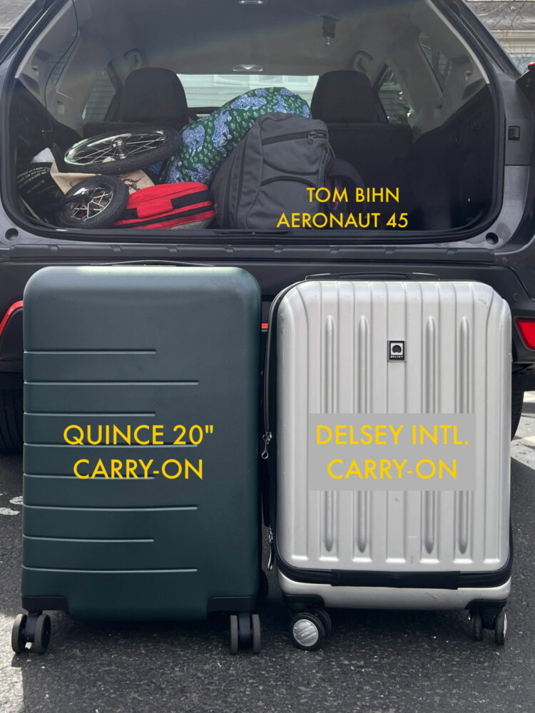 The back of a Subaru Forrester opened showing luggage inside, including the TOM BIHN Aeronaut 45. In front are two 20" rolling suitcases. It shows how the TOM BIHN bag takes up far less space but hold just as much or more
