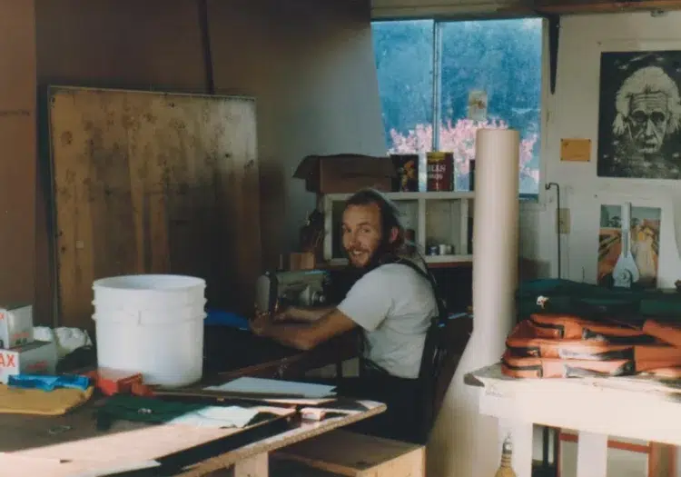 Bag designer Tom Bihn at his sewing machine, circa 1983