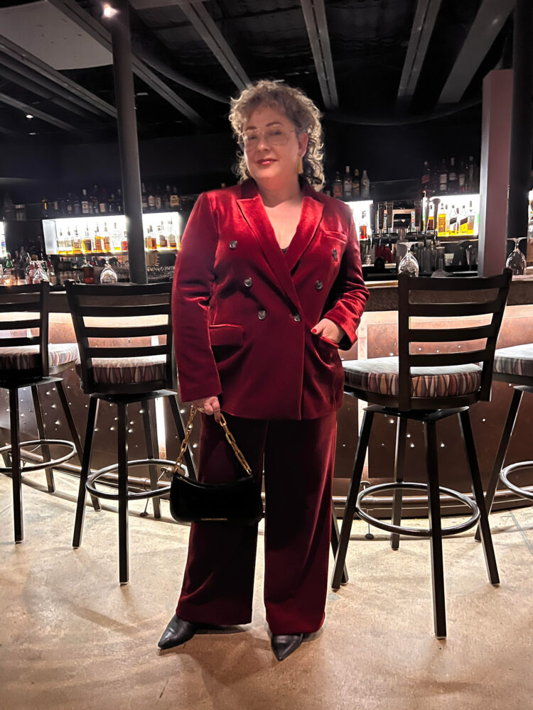 alison gary in a red velvet double breasted cocktail pantsuit from LOFT