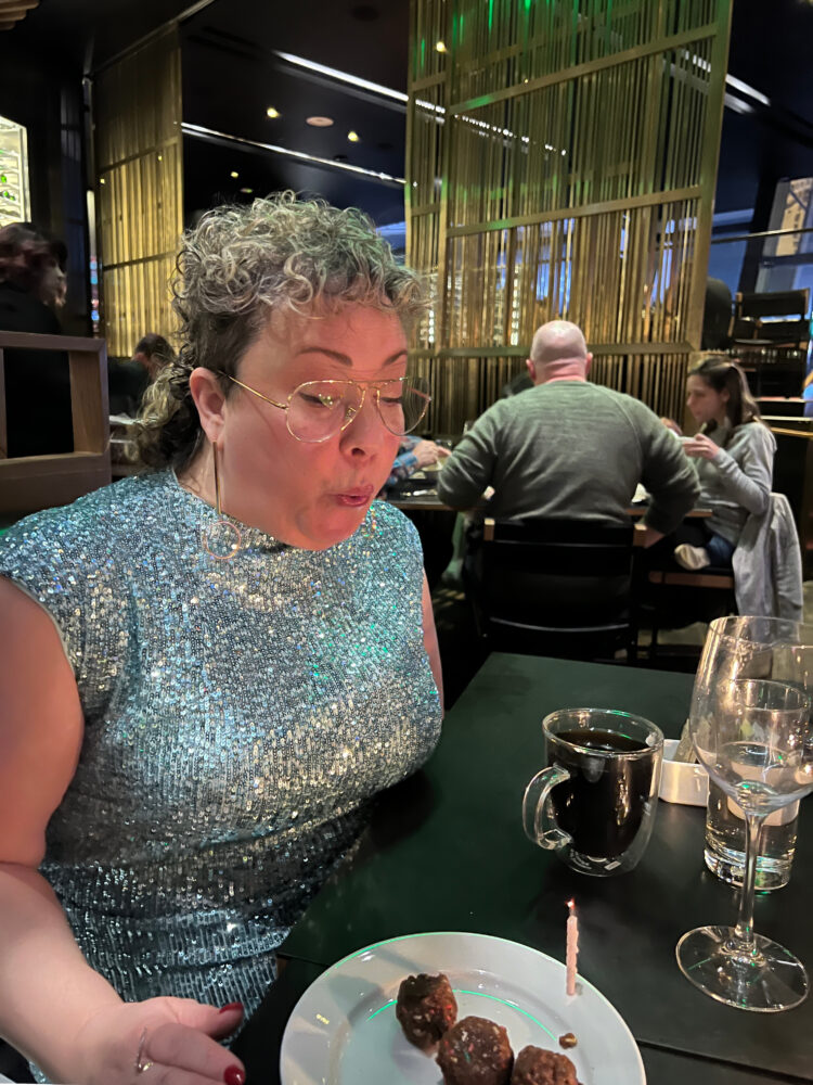 alison gary in momofuku las vegas in an aqua sequined dress from ann taylor and jenny bird edie hoops