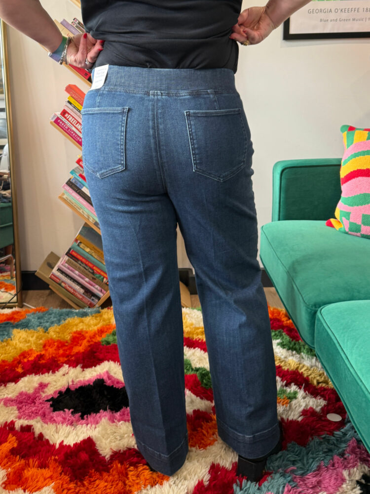 Alison Gary of Wardrobe Oxygen in a black t-shirt tucked into the Talbots Talbots Flare Leg Pull-on Travel Jeans