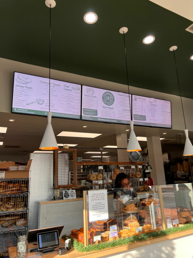 Checking out the menu of sandwiches, coffee, and pastries at The Bake Shop in Williamsburg, virginia